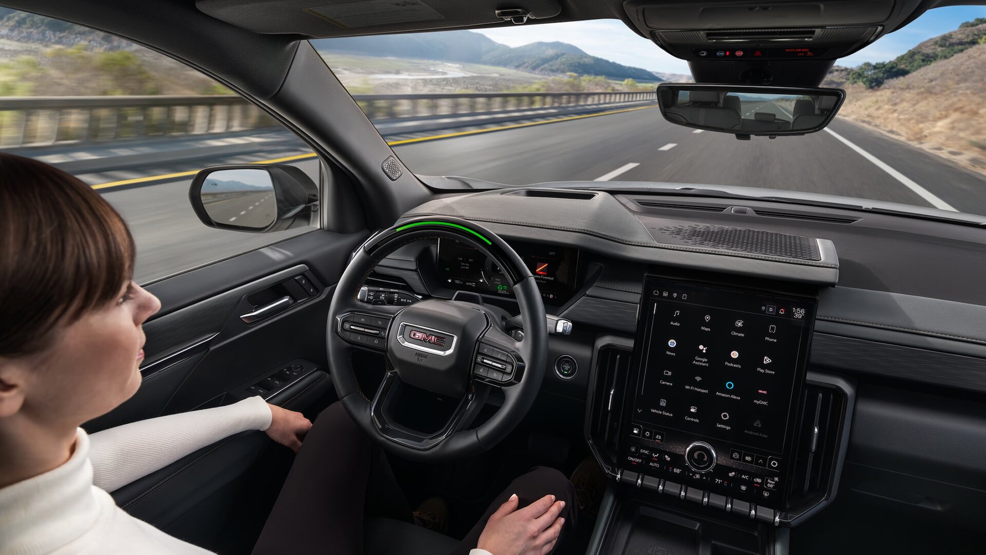 A Woman Using Super Cruise Hands-Free Driving Technology in her GMC Vehicle