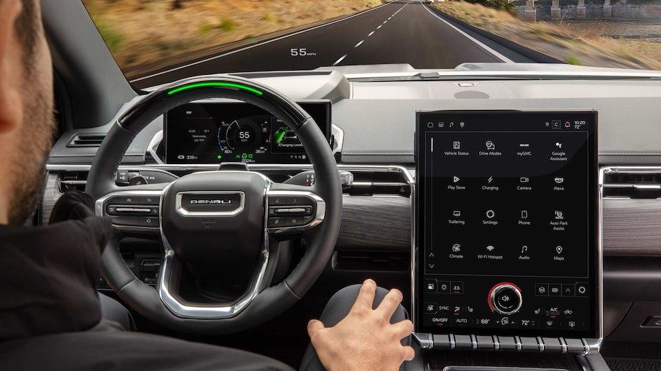 Over the Shoulder View of a Man with his Hands on this Lap While He Uses Super Cruise in the HUMMER EV