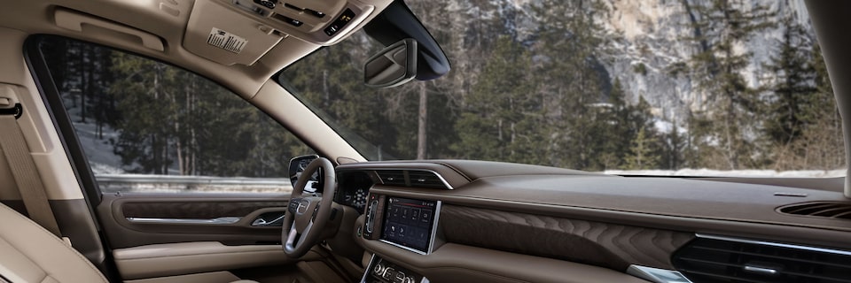 A View of the Front Interior Steering Wheel and Dashboard From the Front Passenger Seat