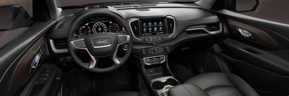 Driver’s View of the Front Black Interior of a GMC SUV
