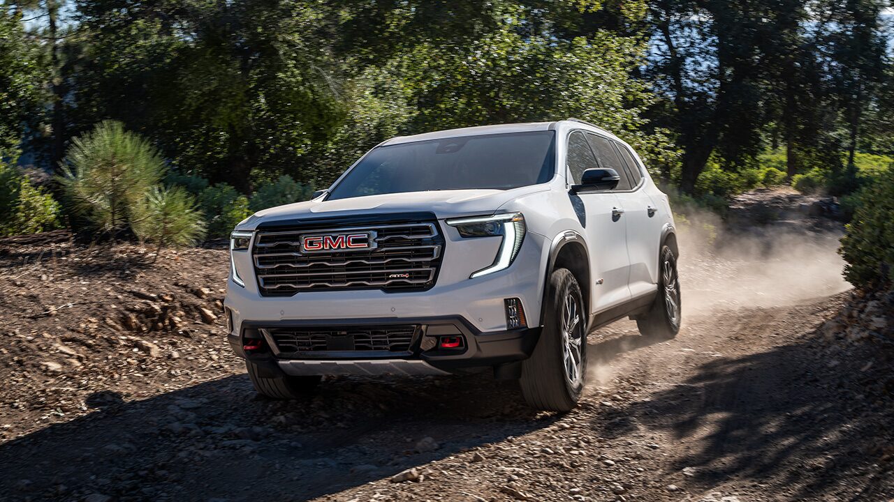 Front View of a GMC SUV Driving Effortlessly Off-Road