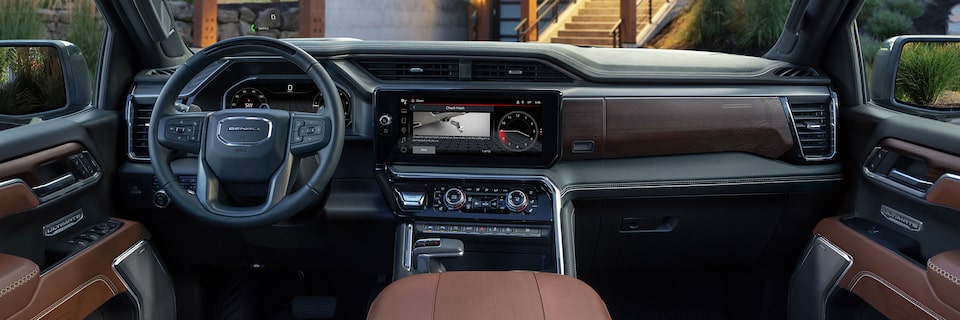 Interior View of the Steering Wheel and Infotainment Screen in a GMC Truck