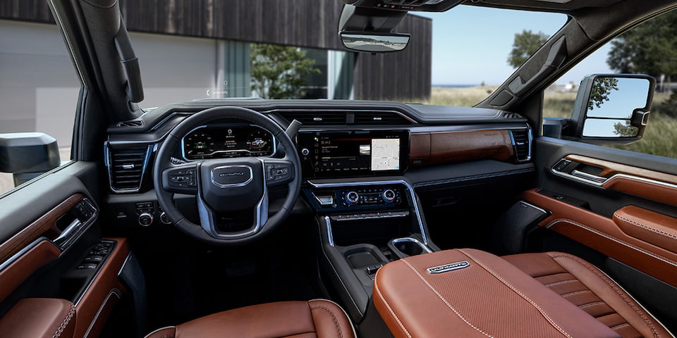 The Interior Dashboard and Steering Wheel of the GMC Sierra 1500 with Leather Seating