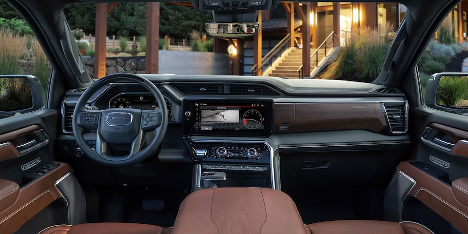 The Interior Dashboard and Steering Wheel of the GMC Sierra 1500 Truck with Leather Seating