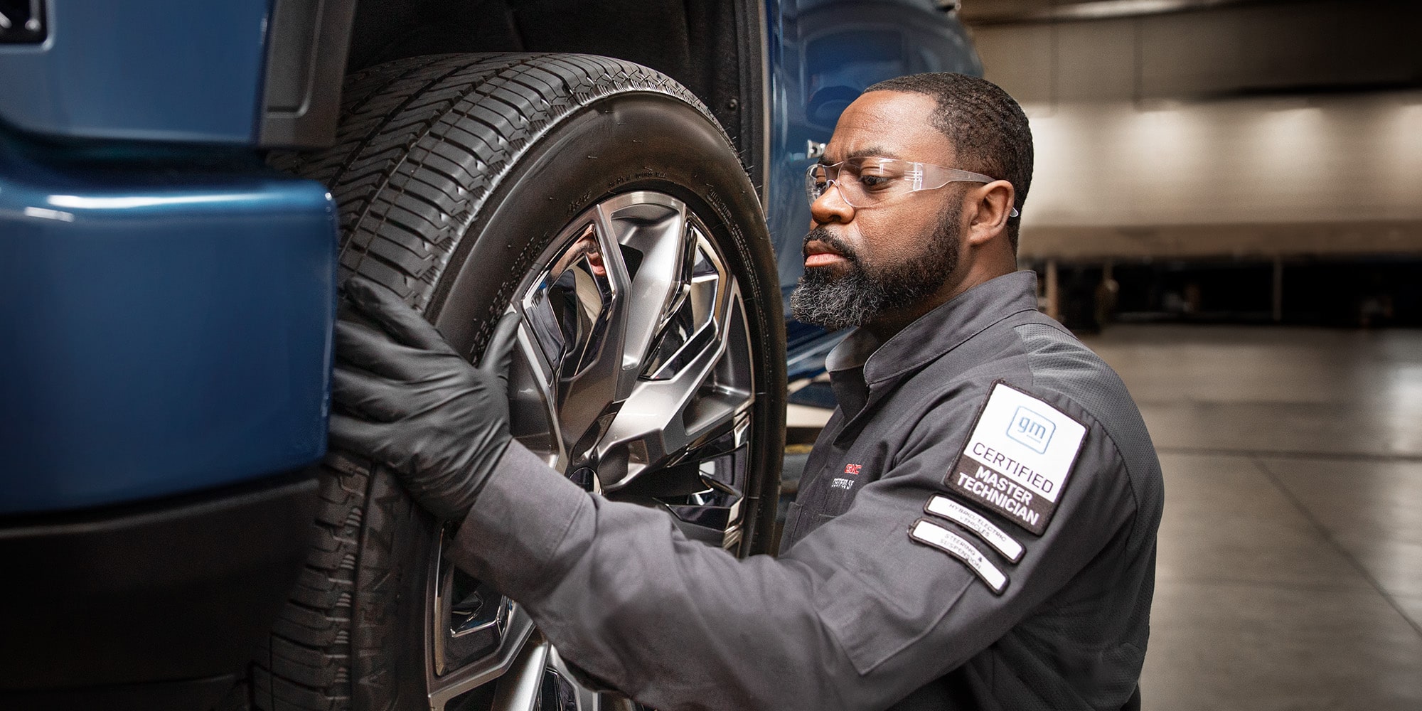 A Close-up View of a Tire on a Vehicle in a Service Garage.