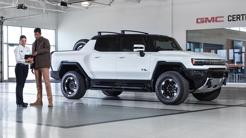 GMC Representative and a GMC Hummer EV Truck Owner Having a Discussion