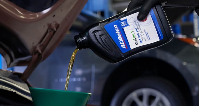 ACDelco Motor Oil being poured into vehicle