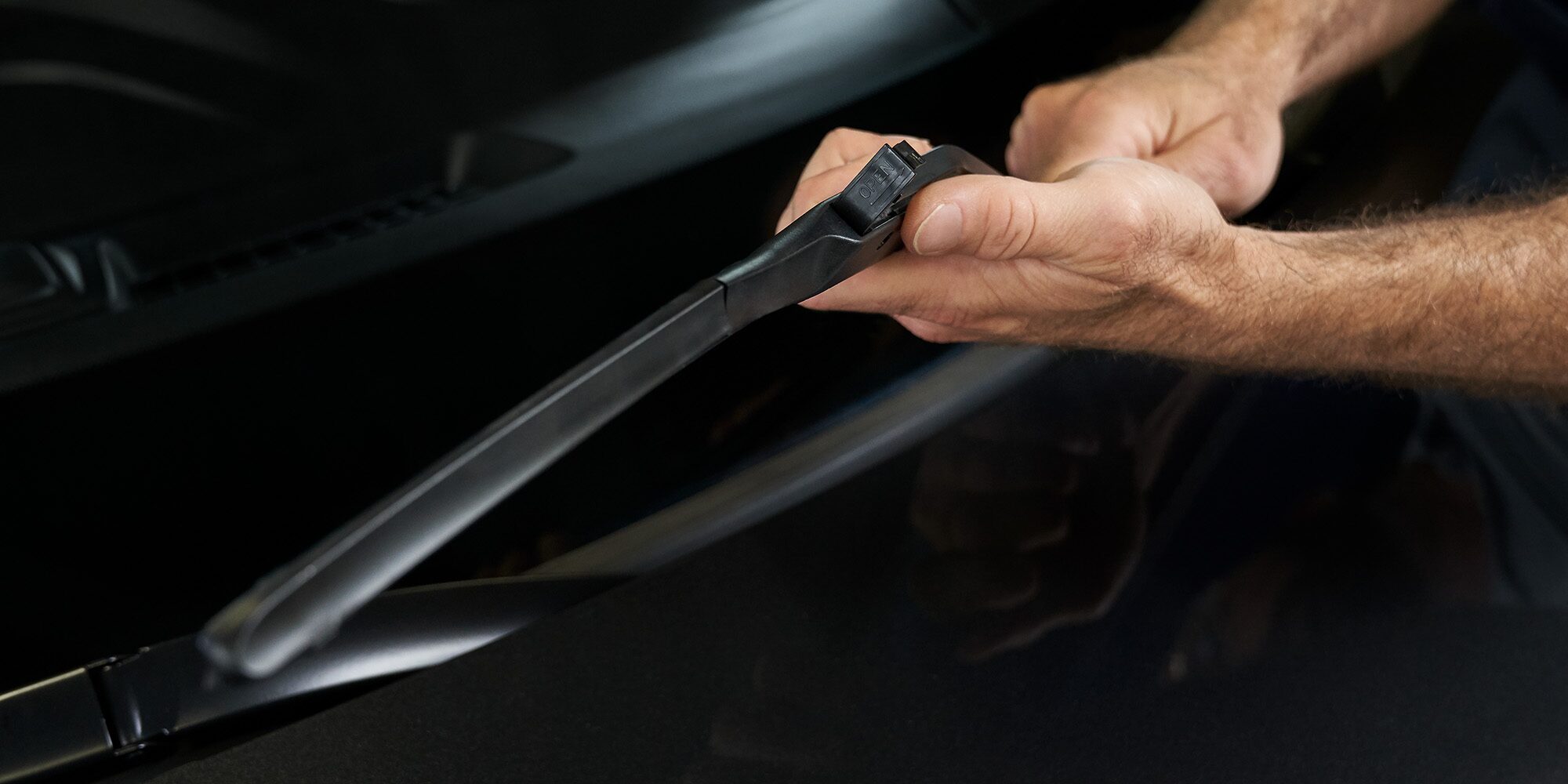 Certified Service Technician installing wiper blade