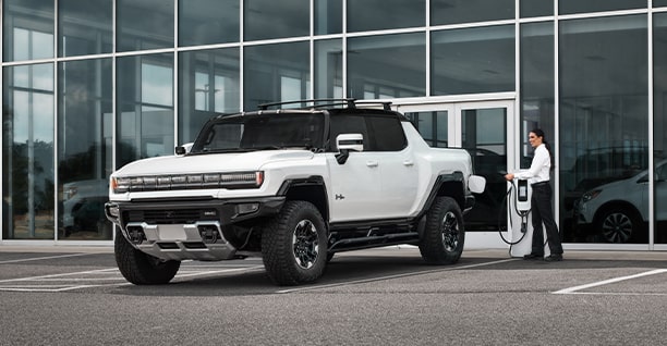 A GMC EV SUV Being Charged