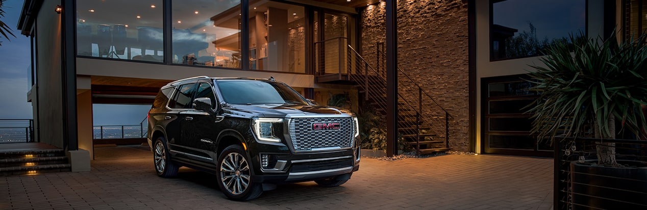 A Black GMC SUV Parked In Driveway