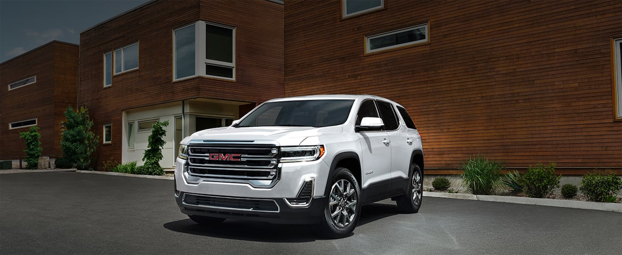 A White GMC SUV Parked Outside an Office