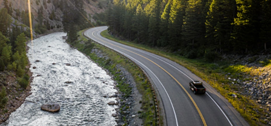 Overhead View of a GMC Truck Driving on a Rural Highway