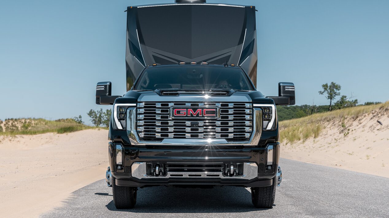 2026 GMC Sierra HD Diesel pulling Camper on Mountainside