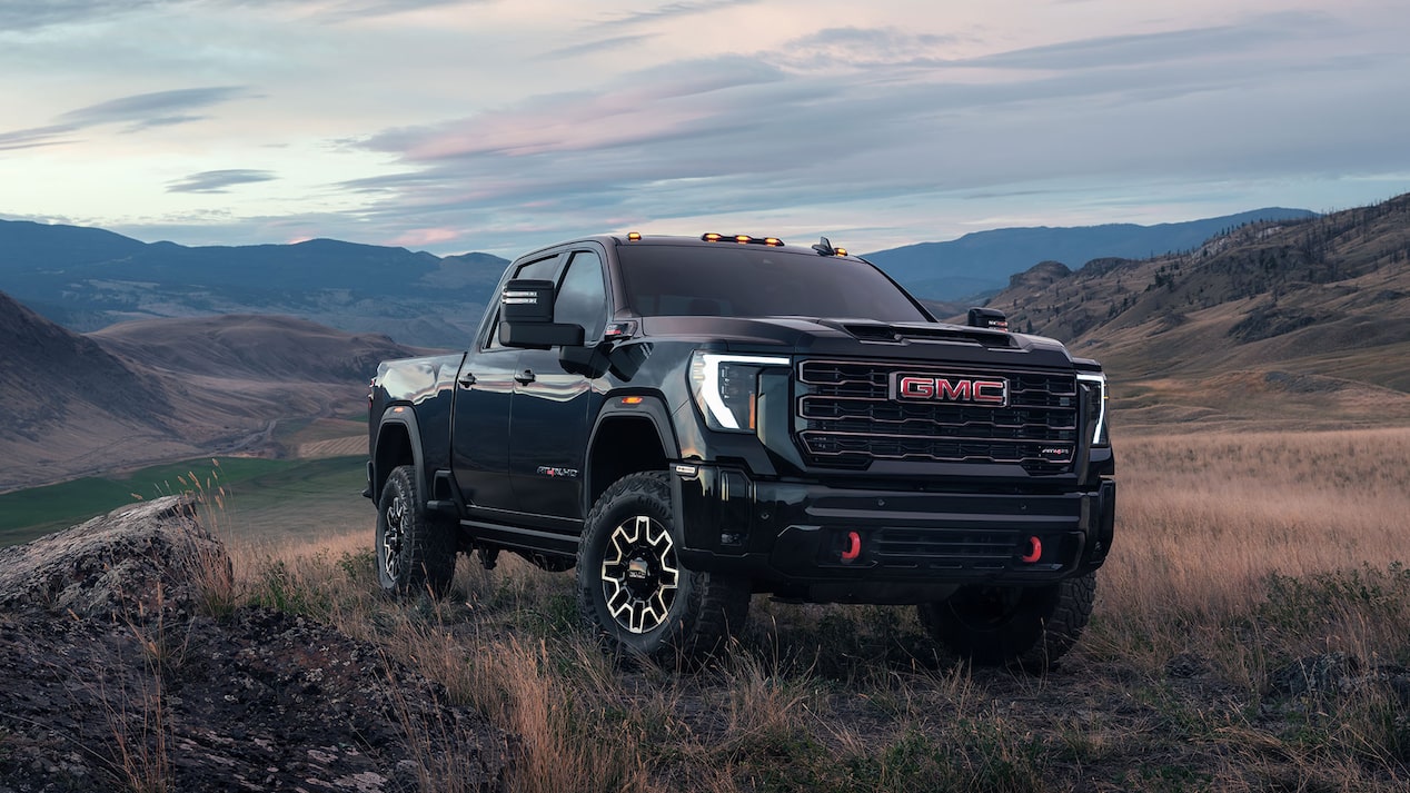 The GMC Sierra HD Truck Parked Off-Road with Mountains in the Distance