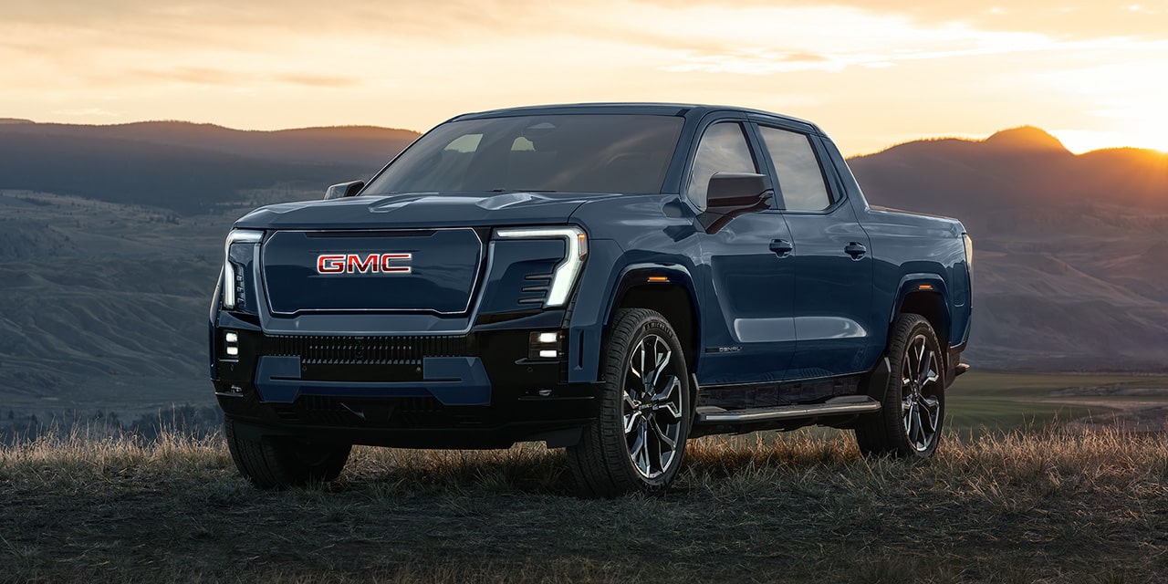 Front Three-Quarter View of the Sierra EV Pickup Truck Parked on the Beach