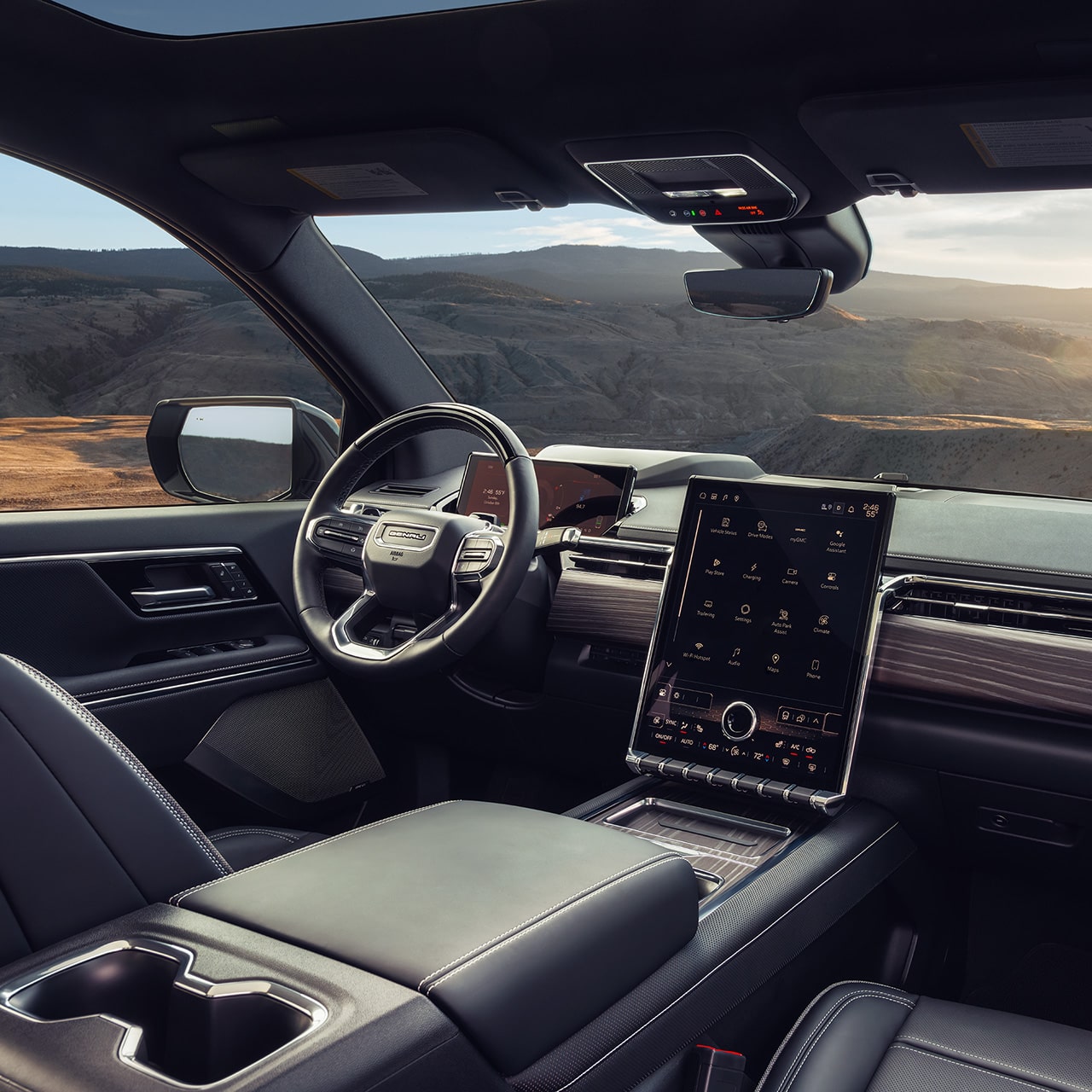 Interior View of the Steering Wheel and Infotainment Screen in the Sierra EV Pickup Truck