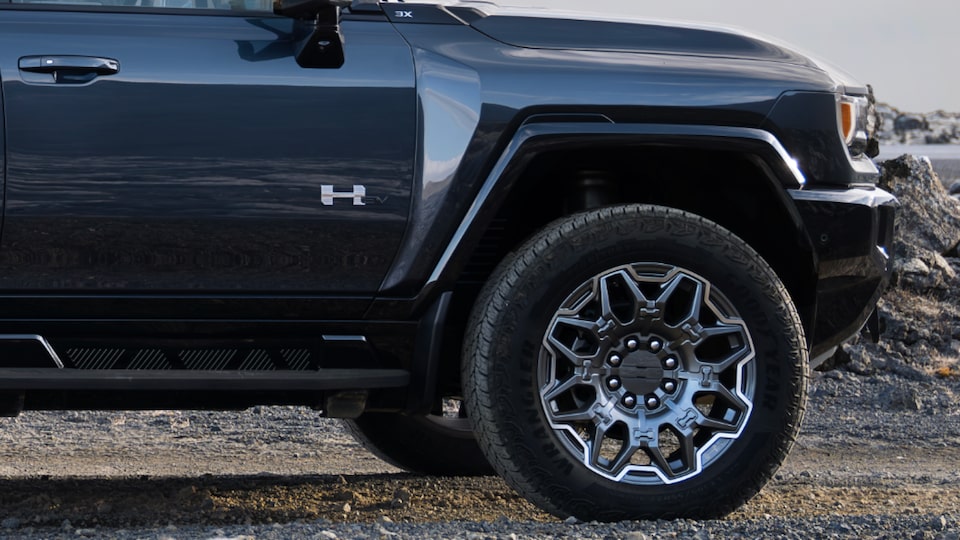 Close-Up Side View of the 2025 Hummer EV Pickup Truck's Passenger Side Door and Wheel Flares