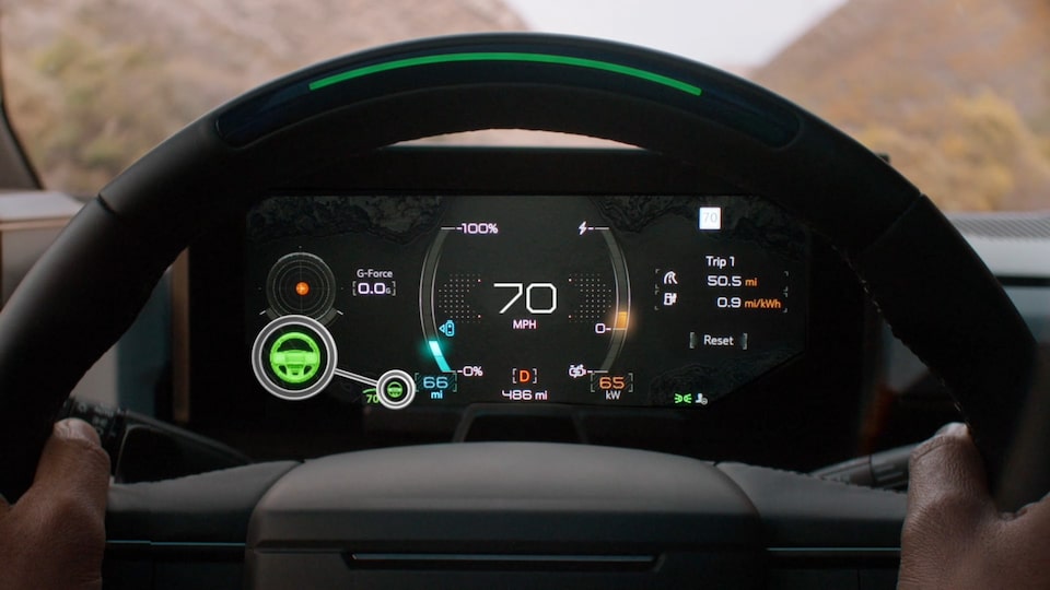 Close-Up View of the Super Cruise Feature on the 2025 Hummer EV Digital Cockpit with a Person's Hands on the Steering Wheel