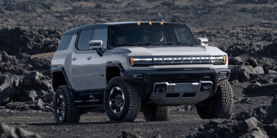 Three-Quarter View of a GMC Hummer EV SUV on a Rocky Plain