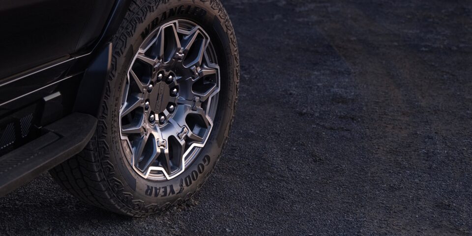 Close-up View of the Front Tire of a Black GMC Hummer EV SUV