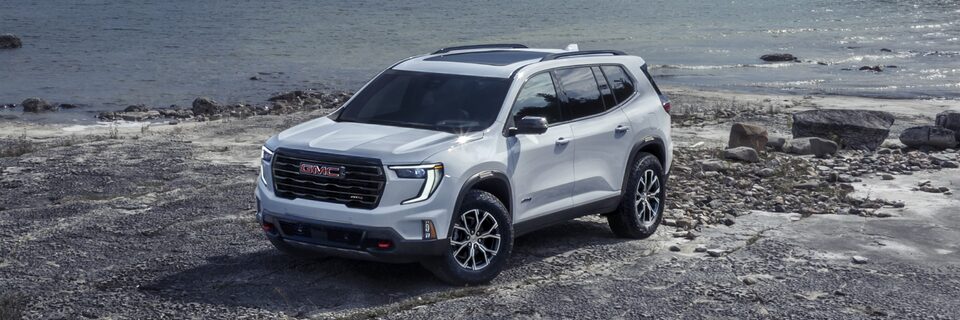 Birds-eye View of the GMC Acadia AT4 Mid-Size Off-Road SUV Parked on the Beach