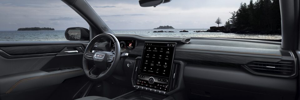 Passenger Side Interior View of the Acadia AT4 Steering Wheel and Infotainment System
