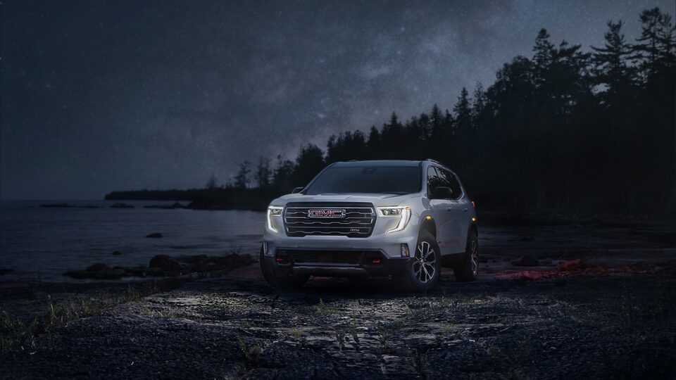GMC Acadia AT4 Parked on the Beach at Night with the Lights on