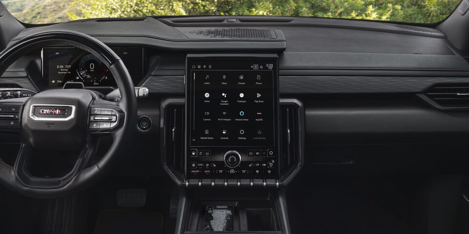 Interior View of the GMC Acadia AT4 Steering Wheel, Infotainment System, and Dashboard