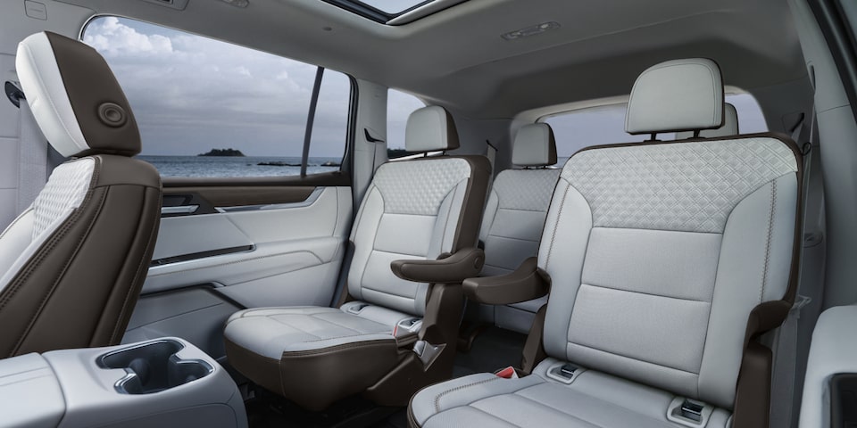 View of the White Interior Second and Third Row Seating in the GMC Acadia Denali Luxury Mid-Size SUV