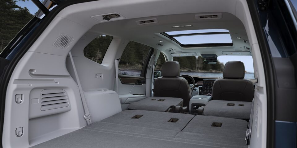 View of the Trunk and Rear Seating Folded Down in the 2025 GMC Acadia Denali SUV