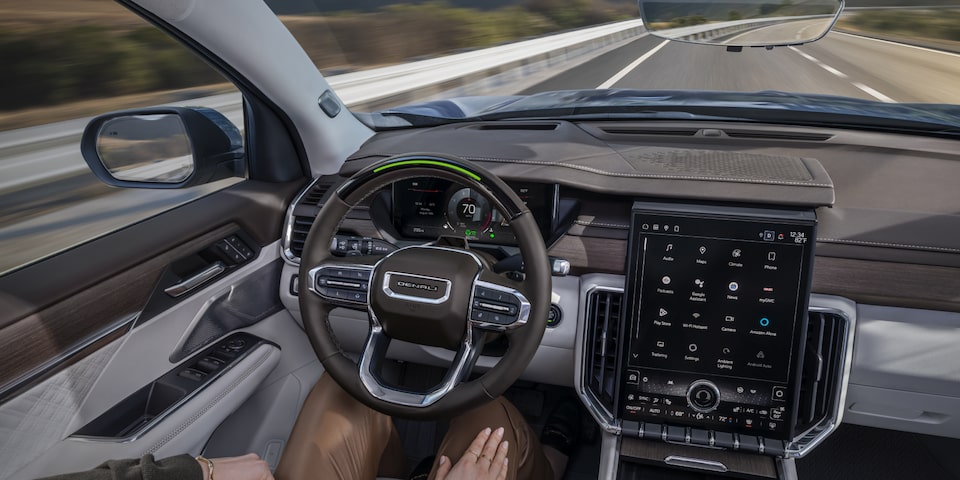 Interior View of the Diver Using Super Cruise Hands-Free Driving Technology in Their GMC Acadia