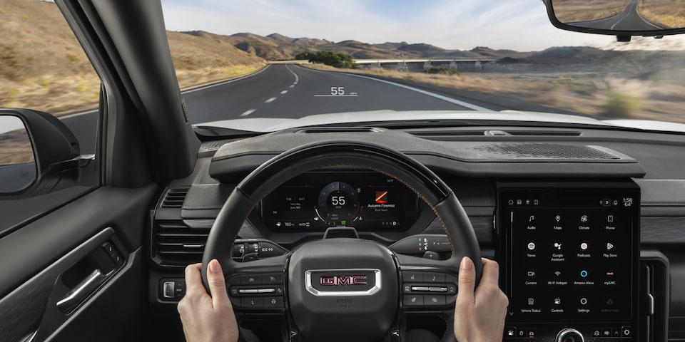 View of the Driver's Hands on the Steering Wheel in the GMC Acadia