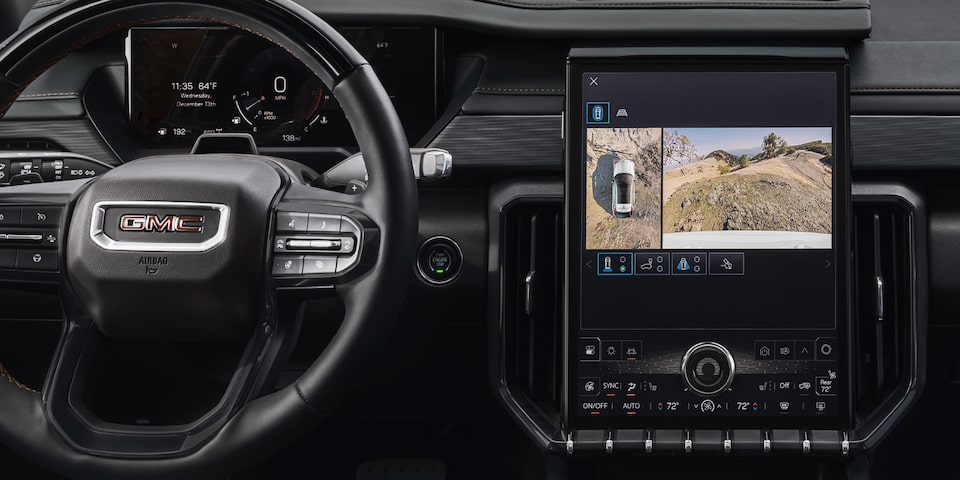Interior View of the GMC Acadia Infotainment System Displaying the Trailering Guide and Camera View