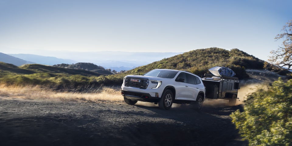 The 2025 GMC Acadia Mid-Size SUV Towing a Trailer Off-Road