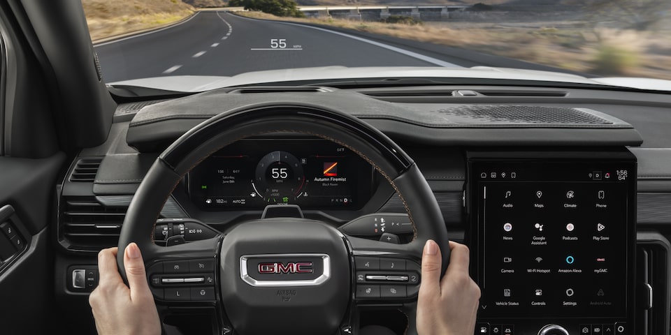 View of the Driver's Hands on the Steering Wheel in the GMC Acadia SUV