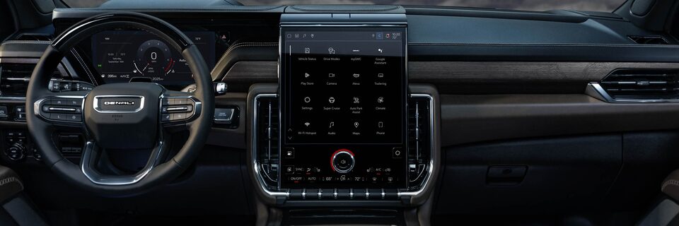 Drivers Side View of the Steering Wheel, Infotainment System and Dashboard in the GMC Yukon