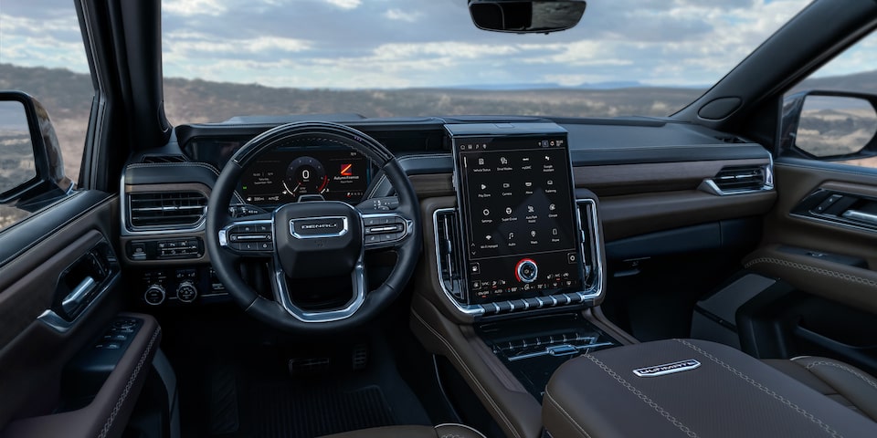 Drivers Side View of the Steering Wheel, Infotainment System and Dashboard in the GMC Yukon
