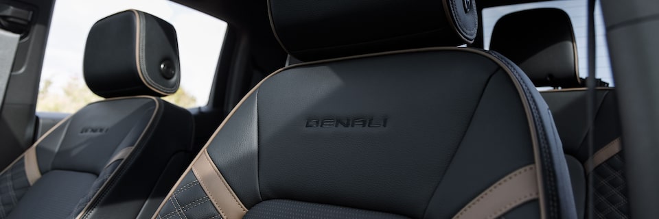 Close-up of the 2025 GMC Canyon Denali Front Row Leather Seats with Trim Printed on Seat