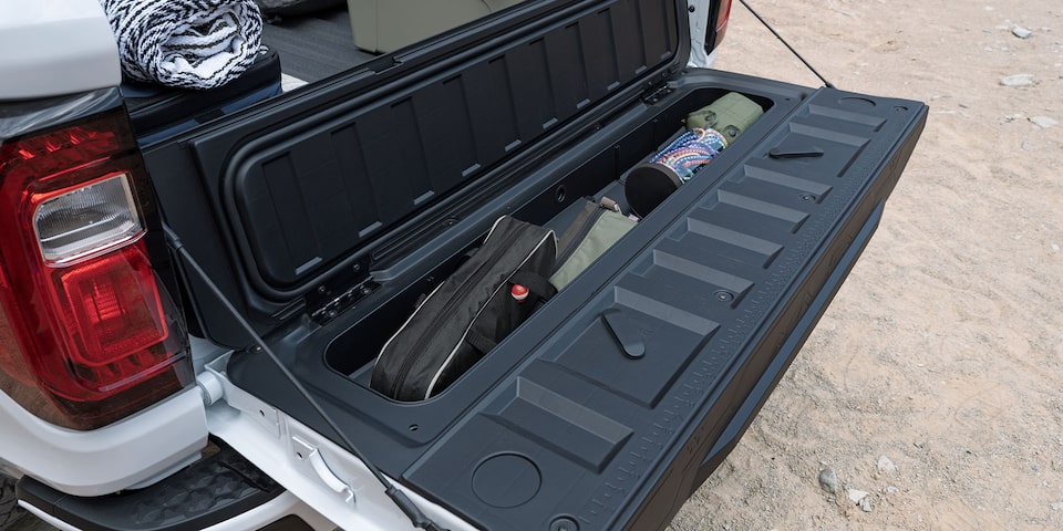 Close-up of the GMC Canyon Multistow Tailgate Full of Fishing Gear