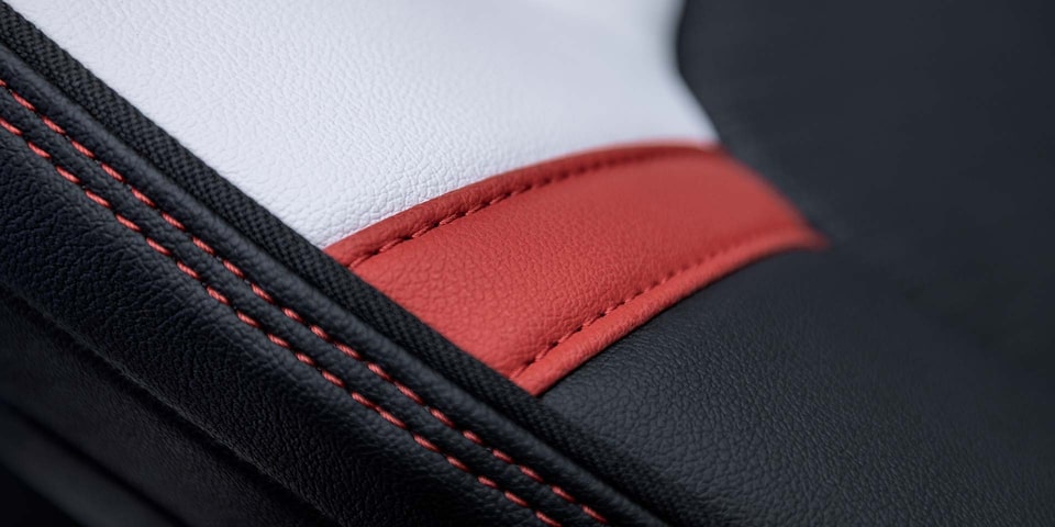 Close-up of the 2025 GMC Canyon Premium Materials and Red Stitching