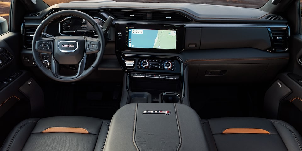 Interior View of Front Seats and the Dashboard in a 2025 GMC Sierra HD AT4 Truck