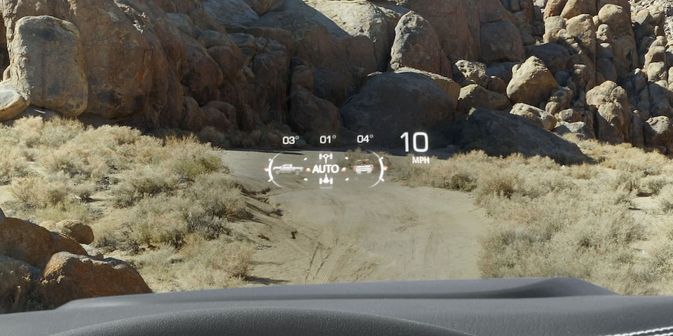Close-up View of the Heads Up Display Feature in Use in a 2025 GMC Sierra HD AT4 Truck