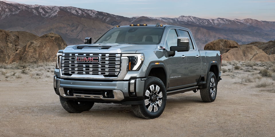 Front Three-Quarters View of the 2025 GMC Sierra HD Denali Truck in the Desert