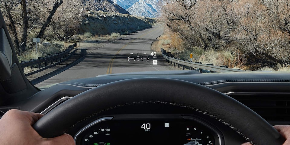 Close-up View of the Heads Up Display Feature in Use in a 2025 GMC Sierra HD AT4 Truck
