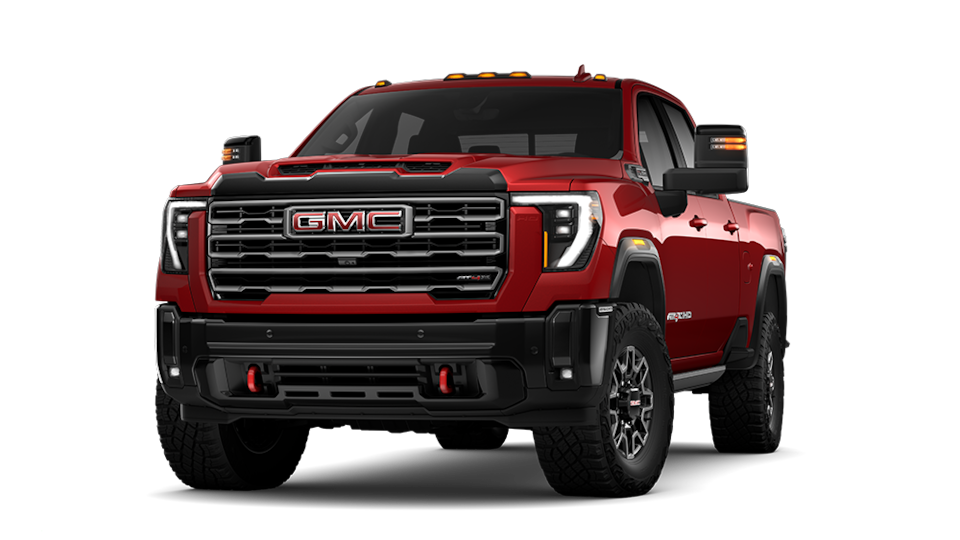 Front Three-Quarters View of a Red 2025 GMC Sierra HD AT4 Off-Road Truck