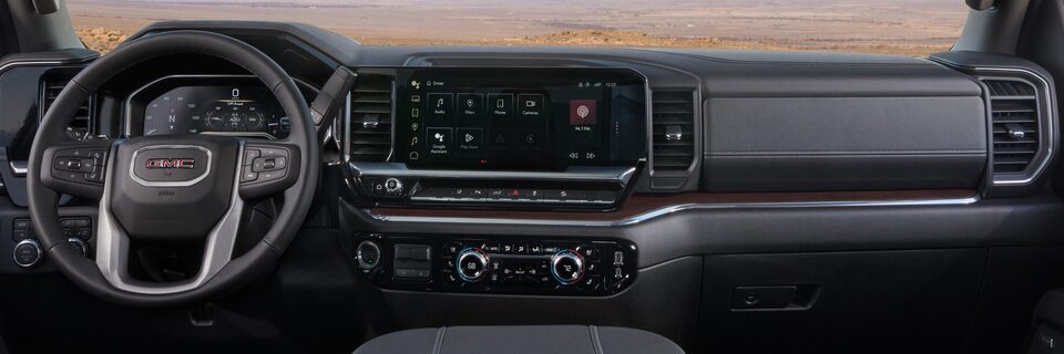 Wide View of the Dashboard, Infotainment System, and Steering Wheel in the 2025 GMC Sierra HD Truck