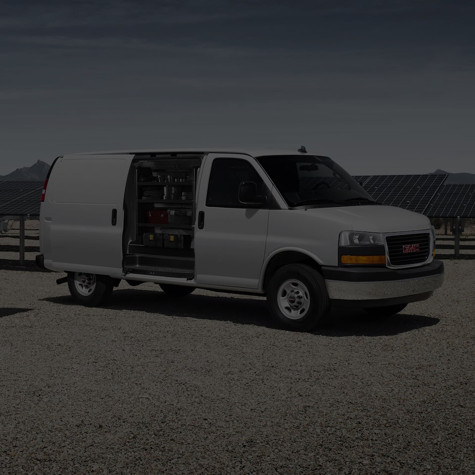 A Side Profile Shot of the GMC Savana Cargo Van with the Cargo Door Open