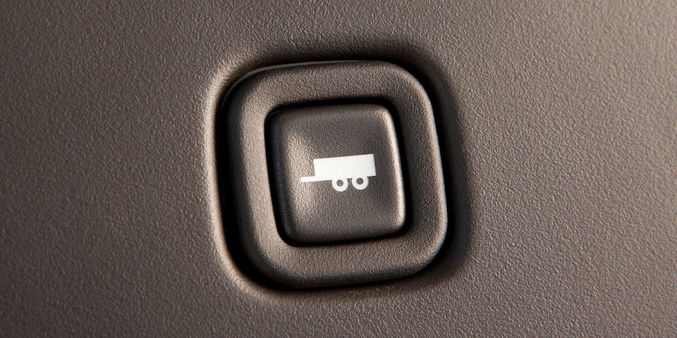 Close-Up of the Towing and Hauling Mode Button in a 2025 GMC Savana Cutaway Van