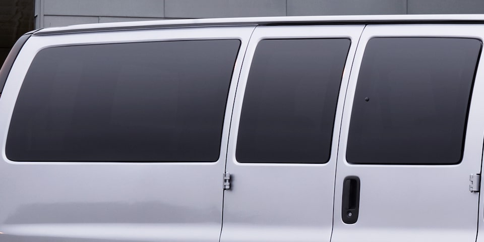 Close-up of the Tinted Windows on a 2025 GMC Savana Passenger Van