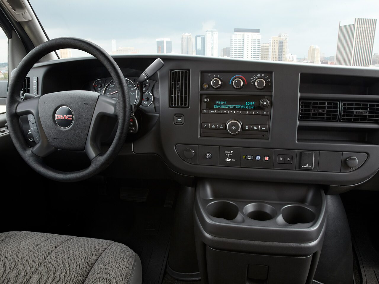 Wide Interior View of the Steering Wheel and Dashboard in a 2026 GMC Savana Cargo Van